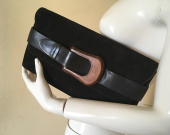 Black suede clutch bag by Carel