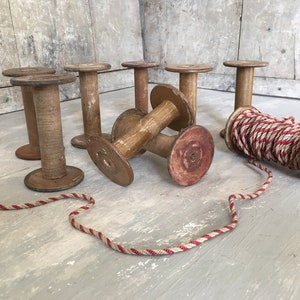 Four antique bobbins or spools