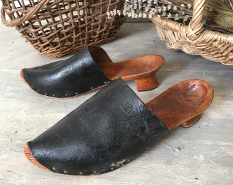 Pair of antique clogs with bobbin heels