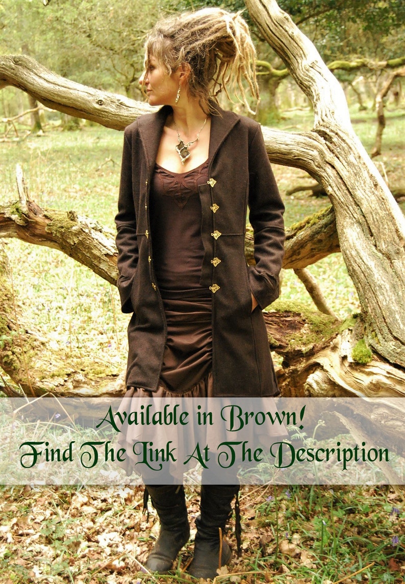 May include: A woman wearing a brown coat with gold buttons, a brown skirt, and black boots. She is standing in a forest with a tree behind her. The text "Available in Brown! Find The Link At The Description" is at the bottom of the image.