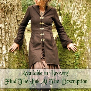 May include: A brown long-sleeved jacket with a hood and decorative gold buttons. The jacket is worn by a person standing in a forest setting. The text "Available in Brown! Find The Link At The Description" is displayed at the bottom of the image.