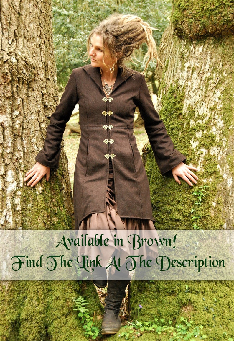 May include: A brown long-sleeved jacket with a hood and decorative gold buttons. The jacket is worn by a person standing in a forest setting. The text "Available in Brown! Find The Link At The Description" is displayed at the bottom of the image.