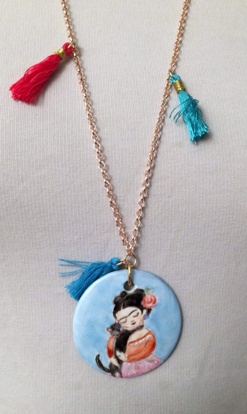 with coloured tassets and hand-painted porcelain medallion, Long necklace in gilded brass