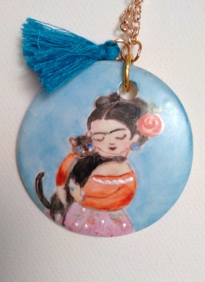 with coloured tassets and hand-painted porcelain medallion, Long necklace in gilded brass