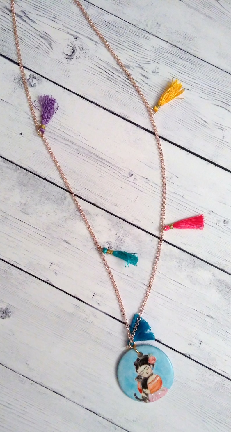 with coloured tassets and hand-painted porcelain medallion, Long necklace in gilded brass