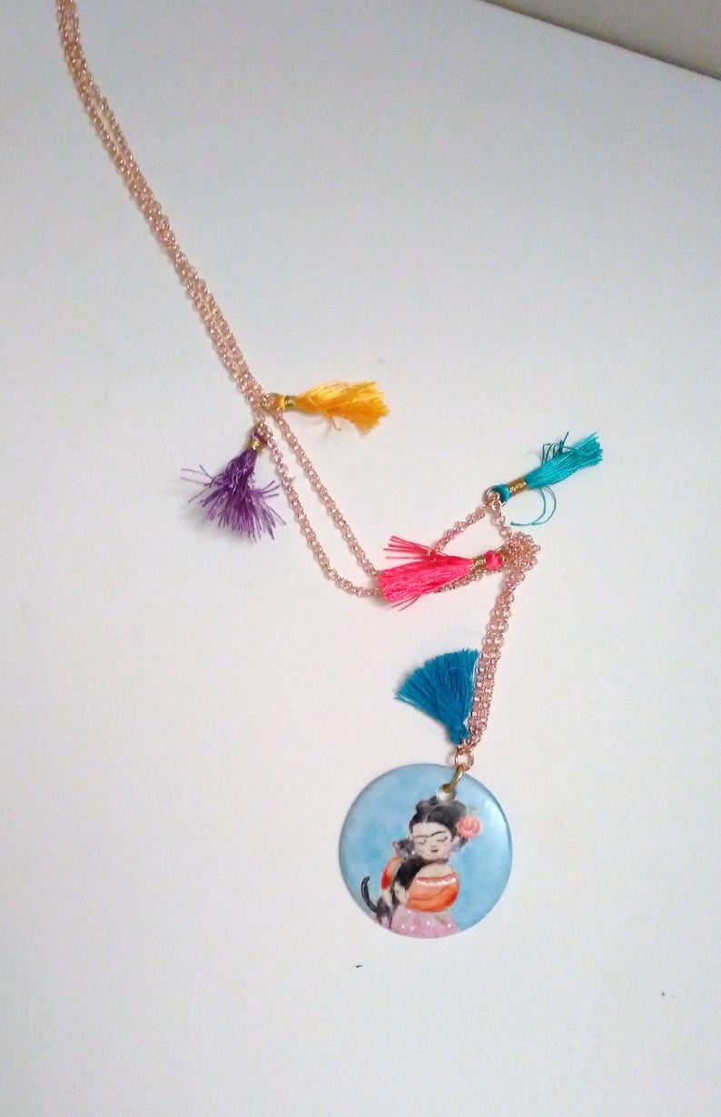 with coloured tassets and hand-painted porcelain medallion, Long necklace in gilded brass