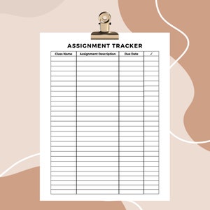 May include: A white assignment tracker sheet clipped with a gold binder clip. The sheet has columns for class name, assignment description, due date, and a check box. The words "ASSIGNMENT TRACKER" are at the top.