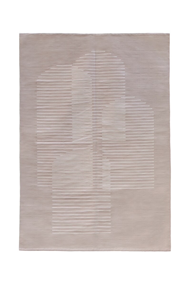 May include: A beige rug with a white geometric design. The design is made up of horizontal lines that create a pattern of overlapping rectangles.