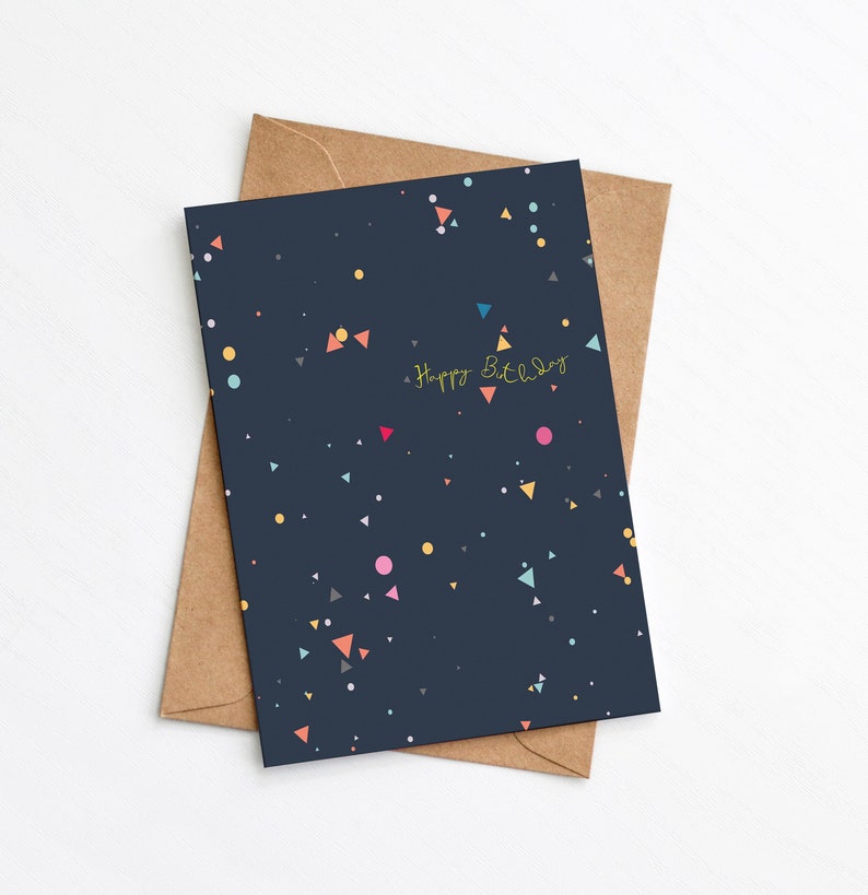 Modern navy birthday card with multicoloured geometric print, and Happy Birthday message in yellow font by Greenwich Paper Studio.