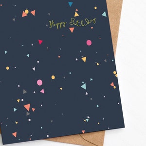 Modern navy birthday card with multicoloured geometric print, and Happy Birthday message in yellow font by Greenwich Paper Studio.