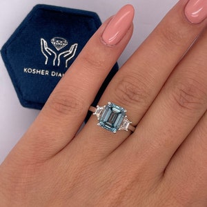 3.5 Carat Fancy Vivid Blue Color VVS2 Clarity Three Stone Lab Grown Diamond Emerald Cut Engagement Ring Side Trapezoids 14k White Gold