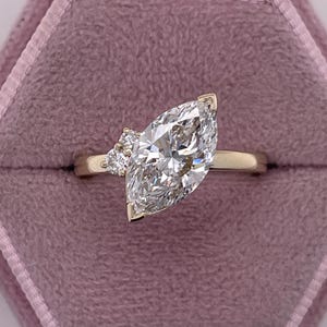 2.05 carat D Color VVS2 Clarity IGI Certified Marquise Cut Lab Grown Diamond Solitaire Engagement Ring 14k Yellow Gold Two Small Side Rounds