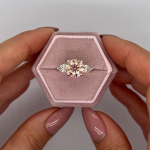 2.5 Carat IGI Certified Fancy Vivid Pink Color VVS2 Clarity Round Ideal Cut Lab Grown Diamond Three Stone Engagement Ring Side Pear Shape