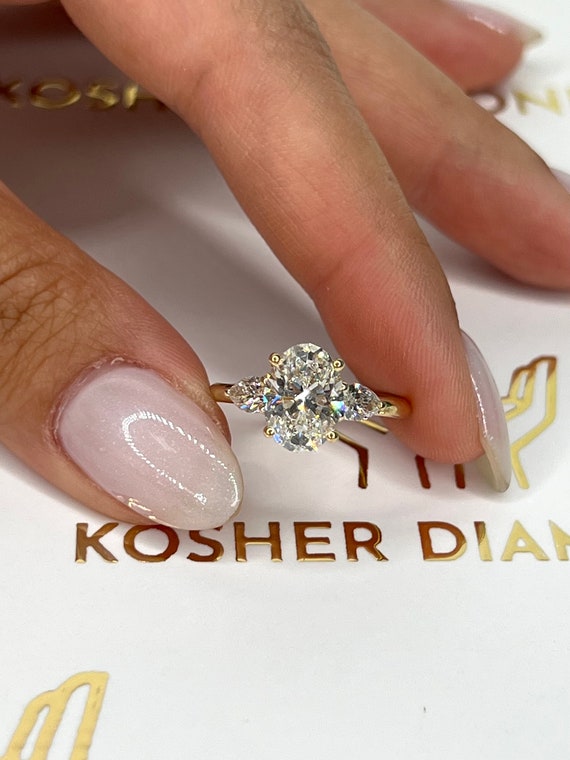 2.5 carat oval diamond sale ring on hand