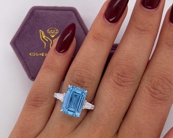 9 Carat Total Fancy Vivid Blue  VVS2 IGI Certified Emerald Cut Lab Grown Diamond Three Stone Engagement Ring Side Baguettes 18k White Gold