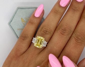 6 Carat VIVID YELLOW color VVS2 Clarity IGI Certified Three Stone Emerald Cut Lab Grown Diamond Engagement Ring Side Trapezoids 18k Gold