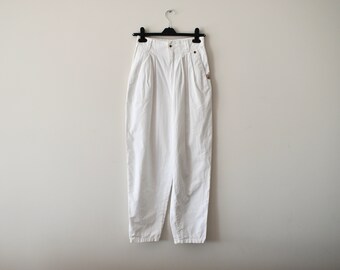 May include: White high-waisted pants with pleats and a relaxed fit.