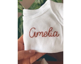 Custom hand embroidered baby bodysuit