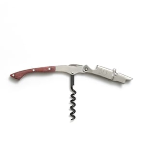 May include: A silver wine opener with a wooden handle and a corkscrew. The opener has a built-in bottle opener and a lever to help remove the cork. The opener has the word "PUSH" printed on it.