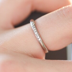 18ct white gold wedding ring with 9 pave set diamonds. UK size M. 18ct white gold eternity ring with G Si diamonds. image 2