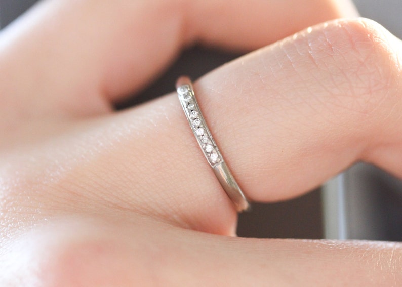18ct white gold wedding ring with 9 pave set diamonds. UK size M. 18ct white gold eternity ring with G Si diamonds. image 2