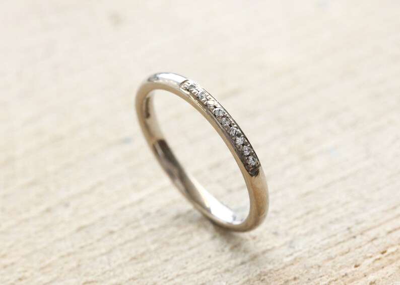 18ct white gold wedding ring with 9 pave set diamonds. UK size M. 18ct white gold eternity ring with G Si diamonds. image 4