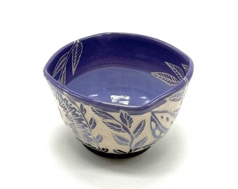 Pottery bowl in deep amethyst, pale purple and black with intricately carved leaves, sgraffito