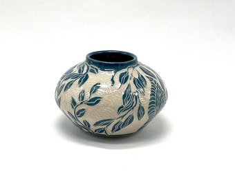 Teal ceramic bud vase with carved leaves, sgraffito