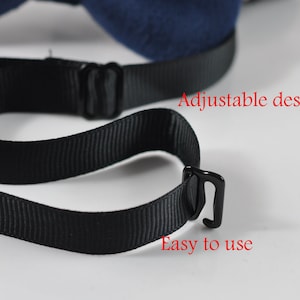 May include: Close-up of a navy blue bow tie with a black adjustable strap. The text "Adjustable design" and "Easy to use" are visible in red. The bow tie is on a white background.