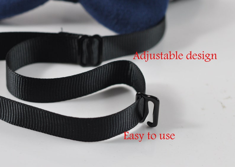 May include: Close-up of a navy blue bow tie with a black adjustable strap. The text "Adjustable design" and "Easy to use" are visible in red. The bow tie is on a white background.
