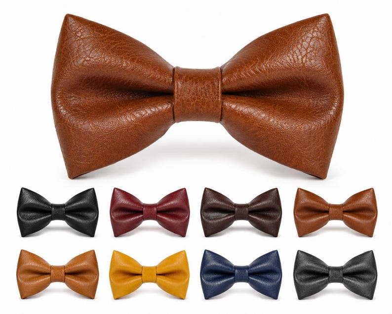 May include: A large tan bow tie with a textured surface is centered above eight smaller bow ties in various colors including black, burgundy, dark brown, light brown, mustard yellow, navy blue, and grey, all featuring a consistent textured finish.
