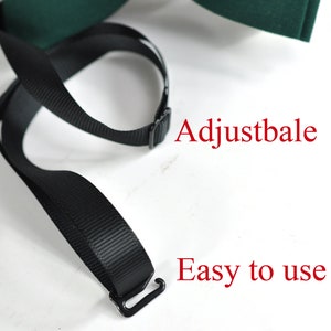 May include: A dark green bow tie featuring a black adjustable strap with a metal hook closure. The image includes the red text Adjustbale and Easy to use, highlighting the functional design of the neck strap mechanism for this accessory.