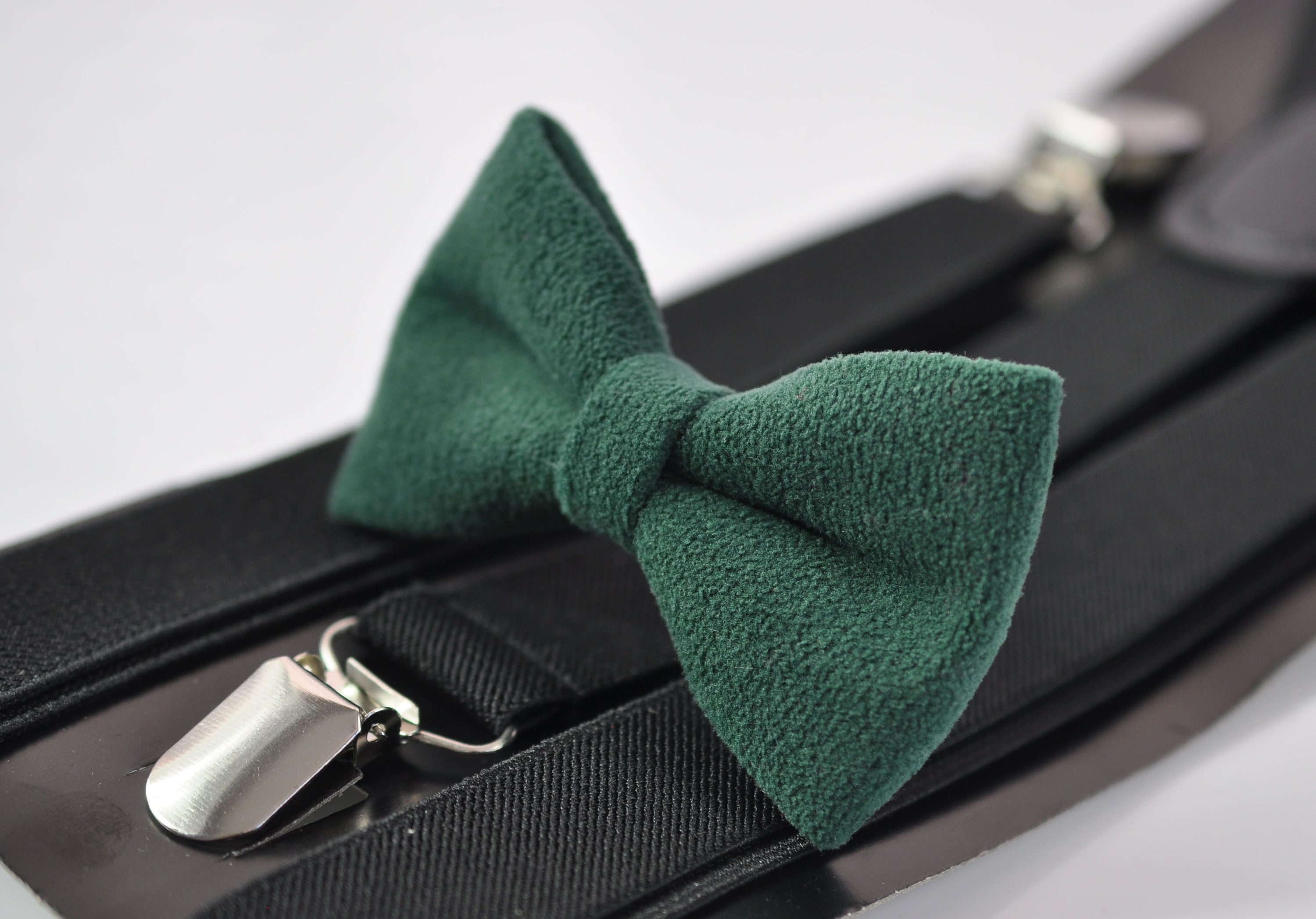 green bow tie and braces