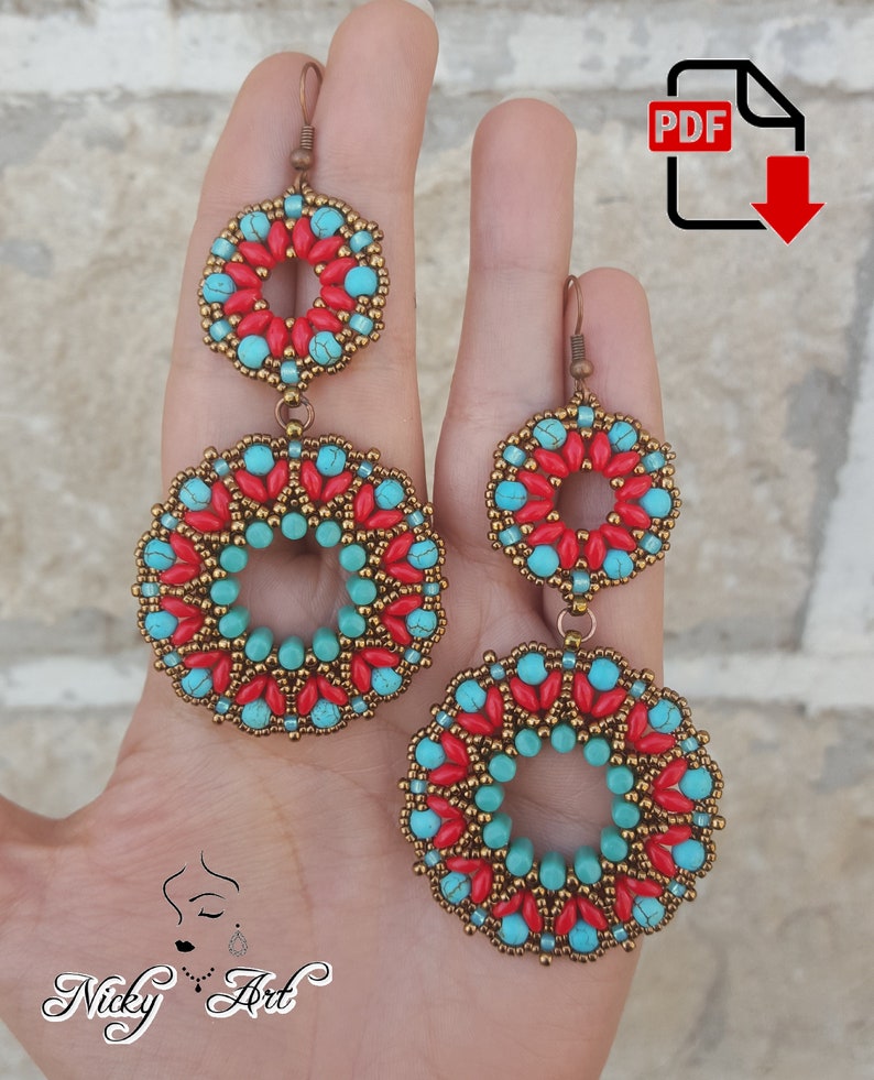 May include: A pair of dangle earrings with turquoise and red beads, featuring a geometric design. The earrings are made with gold-toned metal.
