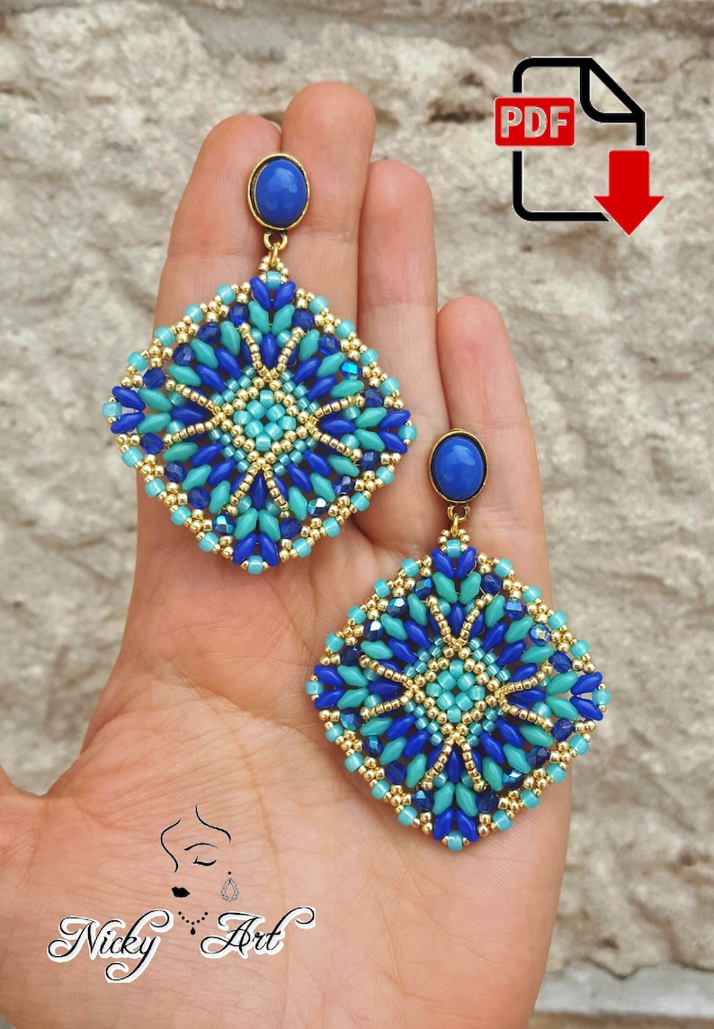 May include: A pair of blue and gold beaded earrings with a square shape and a blue gemstone at the top. The earrings are handmade and have a geometric design.