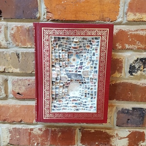 Carved book sculpture &quot;The Eyes of the World&quot;