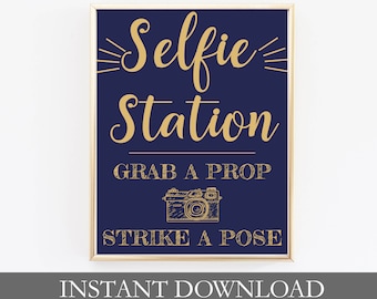 May include: A printable sign with gold text on a dark blue background that says "Selfie Station Grab a Prop Strike a Pose". The sign also features a gold outline of a camera. The text "Instant Download Sized 5x7 8x10 and 11x14" is printed below the sign.