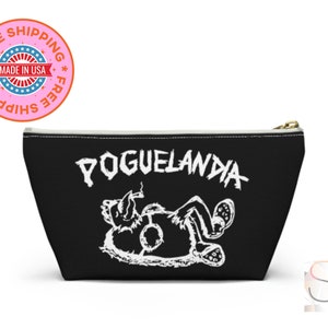 May include: Black canvas zippered pouch with a white graphic of a cartoon character lying down and the text "POGUELANDIA" above it.