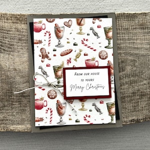 A finished card, from this card making kit, sitting on a wooden board.