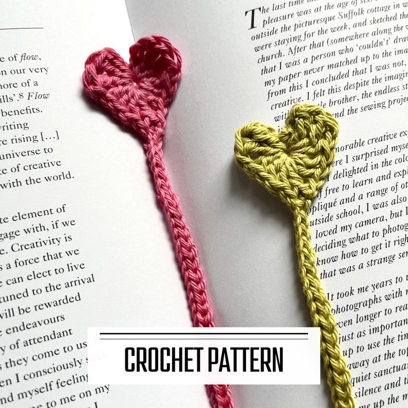 A digital PDF crochet pattern for heart bookmarks. The finished bookmarks are lying in an open book.