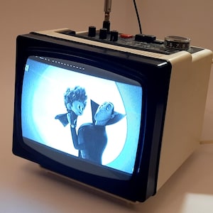 Vintage portable television.Soviet TV.Electronics.Television USSR. Age retro style TV. Props for the film.Home decor.Gift.