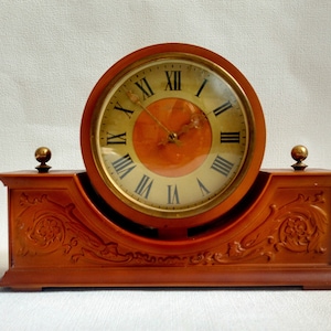Plastic desk clock. Vintage mantel clock USSR 1980s. Mechanical watch. Old clock with key. Retro style Vesna plant clock.