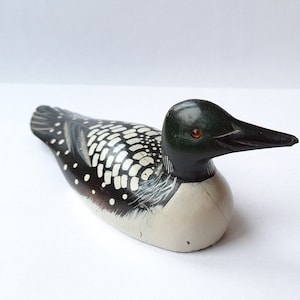 Wooden duck bait. Made of wood, suitable for garden and lake decor.