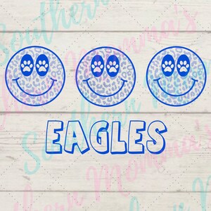 May include: Three blue smiley faces with paw print eyes and a leopard print pattern. The word "EAGLES" is written in blue below the smiley faces.