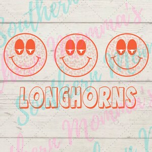 May include: Three orange smiley faces with a white leopard print design and a white longhorn bull silhouette in each eye. The word "Longhorns" is written in orange letters below the smiley faces.