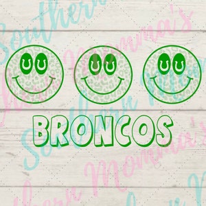 May include: Three green smiling faces with horseshoes for eyes and a leopard print pattern. The text "BRONCOS" is below the faces.