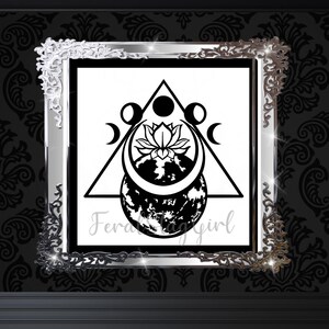 May include: Black and white illustration of a moon, a lotus flower, and a crescent moon inside a triangle. The image is framed in a silver ornate frame.