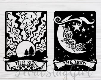 May include: Two black and white tarot card designs. The Sun card features a sun with two trees behind it and the text "THE SUN". The Moon card features a crescent moon with roses and a dragonfly and the text "THE MOON".