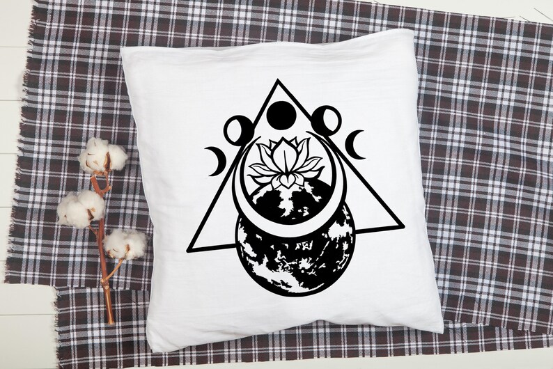 May include: Black and white illustration of a stylized moon, lotus flower, and earth inside a triangle. The moon is crescent shaped and has a stylized face. The lotus flower is in bloom and has five petals. The earth is a stylized globe with continents and oceans. The triangle is an equilateral triangle with a point at the top.