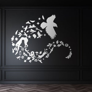 May include: A white silhouette of a bird with wings spread, surrounded by a circle of smaller white silhouettes of various objects, including a cat, a snake, a mushroom, a key, a crescent moon, and a dragonfly, on a black background.